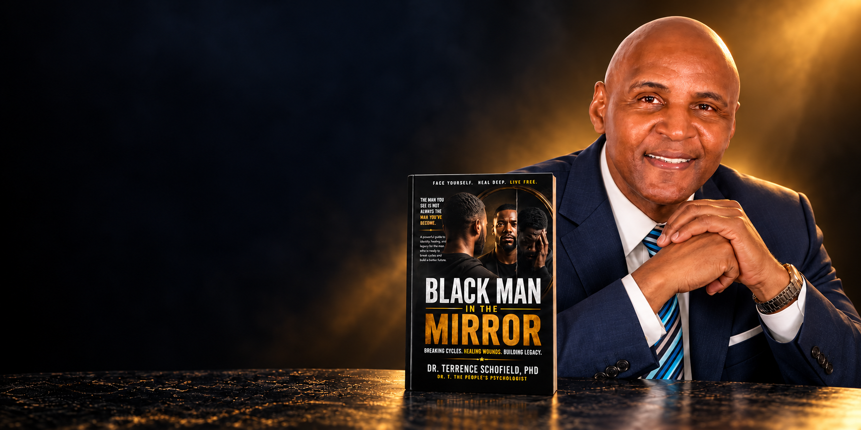 Dr. Terrence Schofield with his book Black Man in the Mirror